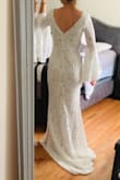 I loved this dress. I actually purchased it as a potential wedding dress, unfortunately I didn't end up picking this one. But I loved the fit, and how simple it was yet romantic. This would be beautiful for engagement photos or even as a wedding gown. - Gabrielle K.