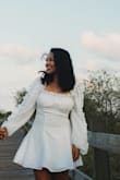 I got a medium because it was on sale and not returnable but I could of fit into a small, its a beautiful dress! Sleeves are fun and it's very fitted around the waist, it is a little see through so nude undergarments would be best. - Itzel P.