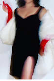I absolutely loveeee this dress. Tight, but really flattering - doesn't squeeze in the wrong places. The slit feels like it starts maybe a tiny bit low - I'm short - but overall it's a great dress. Bought for cruella deville costume and also planning to wear it to a wedding! V versatile - Alanna M.