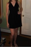 It fit great! Made me feel sexy while still partially covered up. I am very tall but the dress was not incredibly short. There is a black slip underneath the dress which I was not aware of when I purchased and was a great surprise. The material is not to heavy but also not too light. I can't wait to find another occasion to wear it again! The only con I can find is that it was a little bit loose in the back, so I used a little fashion tape to keep it down. - Allison P.