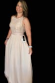 Perfect wedding Dress. Order your true size. Couldn't be happier. Returned the but kept the pink. I wish I'd kept the smaller one but still love it. - Nicole G.