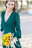 I fell in love in this dress once I saw it. I ignored the tradition of wearing the white wedding dress and ordered this one. The color is deep green, the fabric is not the cheap, it looks more expensive than it is. It's soft and gentle to the skin. No threads sticking out, smooth seams. I liked the similar dress from another brand but it was almost 500$!!! And this one is 58!!! The difference is clear. I didn't want my breast to be seen so I didn't wear a bra underneath, only a black lace top. I am not the tall one so I had to cut the dress and the lining by myself. It wasn't easy))) but I didn't regret about this dress. Everyone (even a photographer) said that green was a right choice with my skin tone, with the sand and the ocean. So that's my favorite dress for now and one more absolutely important thing for me that I can wear it everywhere else besides the wedding. Awesome! - Olesya O.