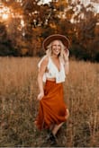 I *LOVE* this top! It's snug to get over the girls but it stays put and I wasn't worried about it exposing anything. It was the perfect boho look for photos! Love love love! - Julie I.