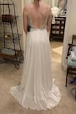 I selected this for my wedding dress!!  Saw it on a blog post on Pinterest, was so excited to see it was available for order, and assumed it would be my favorite.  Ordered 5 dresses to compare sizes and styles.  Even after all of that, this was still my favorite.  Free shipping and return shipping within 10 days is great - take advantage so you can try multiple gowns on!!
The dress feels VERY nice in quality, three layers in the skirt, has nice weight and is not see-through.  The netting for the beading at the top is sturdy and blends in well.  My skin is very light and it looked just fine.  The beading feels very high quality and the detail is so beautiful.  
The skirt is a bit too long for me, and the straps will have to be taken up some, but other than that it fit almost perfectly.  There is a slight "train" on the dress.  
Excited to wear this for my wedding, it'll make for the perfect fit and style for a summer time wedding in the mid-west.  GREAT PRICE
Ps - it is much more sparkly in person! - Katie P.