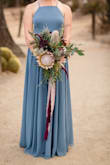 This dress is the perfect dress for any kind of professional photos - from holiday, engagement, or a family shoot. It photographs so well with the light dusty blue color and is gorgeous. Runs true to size. - Mallory M.