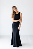 This dress is gorgeous! It fits like a glove and accentuates all the right curves. It's on the tight side but I don't think I would've been happy with a medium. This was my first time ordering from Lulus and I'm very happy with my purchase. The material is thick and has an under layer as well. I didn't have to wear a bra with it. The cuts on the side are sexy yet classy. You won't regret ordering. Oh, and I definitely had to hem it even with 4 inch heels. I'm 5'3", 115 lbs, 34D/DD. - Heather C.