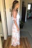 This dress is so beautiful and elegant/flowy! I'm really tall and I could wear this dress perfectly fine with a small wedge. I have large breasts so I was worried a large wasn't going to fit the girls, but I should have ordered that instead of the X-L. But it all worked out, I had my sister take the waist in - which happens sometimes for me anyway because my waist is kinda small. The back is kinda low, so I couldn't wear a bra with it, but it had enough support I felt comfortable without one. It had great quality fabric, and it made me feel so pretty for my engagement shoot! - Kassity W.