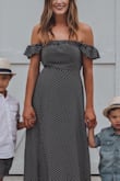 I love this dress! This dress stays put doesn't fall down you don't have to constantly pull it up to keep it on your chest... I am a 34b-34c and there was room if I was fuller chested but didn't look slouchy. - Molly R.