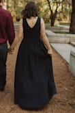 I wore this dress for my engagement photos and I LOVE the way it fits. I've had to get Mediums from Lulus adjusted in the bust before, but this was perfect right out of the bag. I did have to get it hemmed, but that's to be expected. Love the Navy color too, I already plan to wear it for upcoming holiday parties. The V neck was a tad lower than I expected, but I thought it was actually really flattering and not too much. - Taylor J.