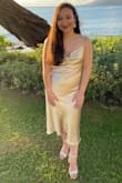 This dress does run Large. I originally ordered a Small and it swallowed me so exchanged for an XS. The XS fit me perfectly. It was perfect for our honeymoon. So elegant. - Nina P.