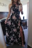 The dress is definitely pretty. It is a darker blue compared to the picture in the advertisement. I thought it was black at first. I had to have it hemmed, there was not way getting around it. It's a pretty dress that can be dressed up or down. - Micaela S.
