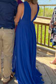 I wish I had the dress hemmed before wearing it but I managed to walk around in it just fine. The material was very comfortable. The slit up the side doesn't show unless you pose a certain way on purpose. It was lined so I didn't have to wear a bra. I would order this in other colors! - Mandy M.