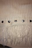 This sweater is perfect. I was nervous because I read reviews that the studs were more bronze, but mine are silver. The color of the sweater is beautiful and just as described. - Sara D.