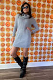 Im an xs and it fits true to size. It has a great lose look but doesnt look too big. Grey is perfect color to pair with different boots. Its comfy & warm but not too hot if the weather warms up through day! - Heather E.