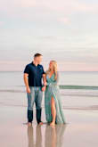 I ordered this dress & two others for engagement pictures. I love the way this dress fits and the quality is amazing. It is just a little low cut in the front but a simple alteration can fix that, if needed (I left it as is for my pictures.) I love the colors in this dress and I am thankful the pictures turned out as well as they did. It was just a little long but with beach pictures it was fine & I'm sure paired with heels, it would have been length appropriate. - Ami S.