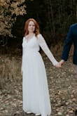 This dress is beautiful, especially given its price point. I got this for an anniversary photo shoot and have gotten so many compliments on it. I ordered a medium and returned for a small as it was much too loose at the sides and the sleeves. If I had given myself more time I would also have had it taken in a little more at the sides as it was still a little loose there (XS would have been too small), and would definitely have it hemmed. I wanted a flowy look for this shoot, but it was hard to walk without tripping if I were going to wear it in public. Totally beautiful and way more affordable than others I'd looked at. - Erin R.