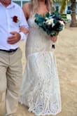 I wore this as my wedding dress in Jamaica. I am usually a size 8/10, but ordered a Large because of my curvy figure and It fit perfect, no need for any alterations. I received so many compliments, I absolutely love and highly recommend this dress! - Stephanie B.