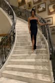 I wore this to a formal November wedding and it was everything I could've asked for & more. The material is so comfortable so its easy to dance, sit and eat in. Also for the tall one's out there: THIS DRESS IS FLOOR LENGTH! I was so nervous that the dress wouldn't be floor-length with heels on but it was perfect. The navy blue is a very nice color but will easily attract any dust - luckily it come off with a quick brush of that area. Get this dress - it's sexy & elegant at the same time! - Aria C.