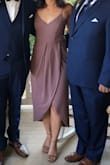 This dress was perfect for a fall wedding! I saw lots of reviews that said to order a size smaller than normal, but I was nervous to order an XS when normally I'm a small or even a medium because I have a big butt for my size. I ordered an XS and S and the XS fit me perfectly so I sent back the small! I didn't need to wear a bra because it fit me perfectly around the rib cage and bust so that was a plus! The dress came within 3 days and returns were super easy. My only issue was that the slit in the dress goes all the way up to waist, so dancing or sitting could be revealing if you're not paying attention. I just used some clear double sided tape to keep it together and that worked well enough, but if I had more time I would maybe take it to a seamstress. - Rebecca T.