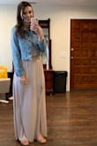 When I first tried on this jacket, I was a bit disappointed at how cropped it looked. However, I bought it for a wedding to go with my bridesmaid dress and it was PERFECT. It falls at a great height to accentuate your waist in a dress. I would definitely recommend this for layering over a dress. - Rachel R.