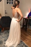 I really loved how this dress made my bust look. Being a bigger bust, but smaller waist is hard to find! It only needed hemmed. I would imagine the inside of my arms probably would've also gotten annoyed with the beaded detail, but it was so sparkly and jaw dropping in person, I wouldn't have cared. It seriously lights up in the light. So pretty! The only reason I decided against it was only for a different look. - Mackenzie H.