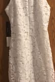 I bought two pieces for my wedding shower and ended up not wearing this one. It's absolutely beautiful, but I have no reason to keep it. Still has tags attached and no blemishes whatsoever. It's actually been hanging on my closet door since the day I got it in the mail. - Majestee H.