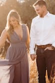 I love this dress!! I bought it for our engagement photos! I ordered a Medium because of all of the reviews and I usually am a true medium but this dress was big around my waist! I returned it and got a small and it fit perfectly!!! I got so many compliments on it! I were a size 6 in American eagle high waisted jeans (for reference)! Highly recommend!! - Kailey L.