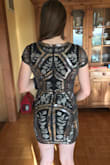 It's a really flattering dress! And I usually don't do well with body con. The cap sleeves make it hard to move your arms around especially to lift them above your head. To sit comfortably I also have to pull up the skirt a little so it doesn't squeeze my legs too tight. Otherwise it seems really high quality, the design is flattering, and the length is great (not too short!). Perfect for New Years Eve! - Summer V.