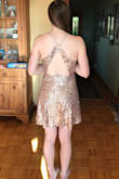 My only disappointment with this dress is that it's not rose gold. The pictures make it look almost pink but it is a true gold with a nude base color.  Otherwise the fit is great and I LOVE the length - I was afraid it was going to be super short but it hits nicely at mid thigh. Great for New Years Eve! - Summer V.