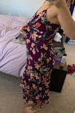 I ordered a size small and I am absolutely SWIMMING in this dress. I have a small waste but larger hips/thighs and there is no reason a small should be this loose on me. The model in the photo must be wearing an XXXS to fit like that. Unfortunately, I bought this one on sale so no returns/exchanges. Very disappointed in the sizing guide. - Elle U.