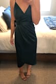 This dress is great. Good quality for the price, and I LOVED the color. Definitely got some compliments. Its more of a blue green than a true green. I wore it to a winter wedding and danced all night. It's a great length and pretty comfortable! You can wear the bow/sash on the side or in the back. I did it in the back, classic and pretty. - Shanae P.