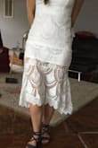 This is a gorgeous dress! I am so excited to wear it to our rehearsal as well as our Boston and LA reception BBQs. There are a few issues though... The white lining under the lace is really short. I am considering bringing it to a seamstress to have them add a few inches for modesty. It also rides up as I wear it. See the second photo. In addition, the lace at the bust is misaligned and makes the boobies look real weird. See the first picture. I wasn't sure if it was just me being OCD---but I checked and it isn't like that in the model's photos or many of the review photos. So I think I got a dud and need to exchange it to try again. - Kassi W.