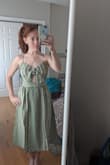 Absolutely love this dress! The material feels really sturdy and the bow and keyhole opening in the front are adorable. I need to iron/steam the wrinkles out of the skirt but I can't wait to wear this dress. I ordered the xs (5'3" 107lbs) and it fits great around my ribcage/waist. I'm short so I'm going to wear a taller heel with it because midis are always a little longer on me. - Julie L.