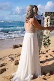 I was looking for a non traditional dress for a wedding on the beach.  Something pretty and age appropriate since I'm 62. I was more than happy when I saw it out of the bag.  As everyone else stated, the dress is beyond gorgeous.  It was perfect for my beach wedding and the movement is very pretty. The only thing I had to do was get it hemmed.  You will not go wrong if you decide on this dress. Best of all, my husband loved it as well. - Doris H.