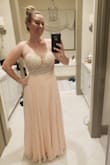I was really nervous about this dress being final sale. I read the other reviews and prayed it would work. I'm a bridesmaid in a wedding in Maui and her color is blush but she loves sparkles...so this fit the bill. It truly is stunning in person. This pic is in bad lighting, with no bra or spray tan and I still think it looks great! I liked the cups and will buy a sticky bra to help with support. - Kim G.