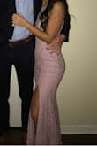 I ordered this a few days before a sorority formal, so I was very excited when it fit perfect with no alterations needed. The slit was the perfect height and the dress altogether was really pretty. Great quality and material. - Rylee H.