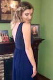 My daughter loves this dress. It is very stylish and comfortable. It fit her perfect!! She received many compliments and people wanted to borrow it. It was a little long for her, so we had it shortened and she also wore heels. - AMY J.