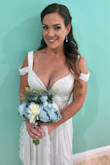My dress was perfect for my wedding day! I had to get the dress hem and the zipper is a little tough to pull up but other then that it looks amazing! I am usually a small and this dress had to be a medium. - Arleen R.