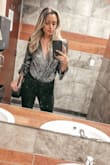 This is one of my favorite pieces I have ever bought from Lulus. I want to write an honest review about my experience with it and how well the Lulu's team handled it:
I wore this bodysuit out to barhop with friends. Once we got home, I took it off and went to bed. When I woke up, there was a huge purple stain on our white sheets and we noticed my skin was also purple tinted. I contacts Lulus and they were so wonderful about everything. We worked out a fair resolution. They also informed me that this was a one-off experience and that it has not been reported by anyone else. But just in case, make sure you check to see if any purple has rubbed off on your skin once you take it off (FYI the bodysuit does NOT look purple, it looks black with gold metallic glitter).
Because of how much I loved this bodysuit I didn't want to give up on wearing it. I soaked it in warm water with detergent and washed it twice before hang drying. That seemed to do the trick because I haven't had any staining since. - Ashley S.
