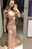 I wore this dress to a NYE wedding and loved it! I got so many compliments! The dress was comfortable but the sequins would catch on itself making it a one time wear. I said it runs a bit large because I am between small and medium and the small fit me great! I would definitely recommend this dress for an event, I felt fabulous! - Elizabeth F.