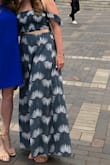 I wore this dress for a dinner cruise and liked it overall! The fabric is thin, but nice for the summer. However, the straps were a lot thinner/had less fabric than the model picture online and the top wasn't cut in a straight line so that kind of bothered me. Also, I have wide hips/a larger bottom half so the skirt wasn't as flattering on me because it flared out at the bottom. The side slits barely show unless you really stick your leg out to the side and I altered the length because it comes long, but I'd rather that than come too short! - Julia P.