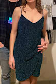 This dress is definitely at winner! It fits true to size and the stretchy material made it super comfortable. The material is a little more sparkly than it appears online but I still loved it. I'll be finding excuses to wear this fun dress again! - Brooke W.