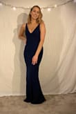 Size medium. I got this dress for a military ball. It was classy but also sexy at the same time because of the v cut at the front. It was a little large but I kept the size. - Madison P.