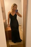 I ordered this dress for a winter gala and it fit perfectly! I am pretty small in the chest so there was a lot of room there and I actually had some room in my hips. I may have been able to go down a size but I liked how it fit well enough. Its a thick material so it smoothed some lumps and bumps and it was very comfortable to wear all evening. I didn't want to take it off! It's a classic beautiful dress and I got compliments on how good it looked. Very happy with my purchase. - Jill G.