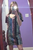 I bought this dress for one of my senior picture outfits because of New Year's and I think it's going to look great! This dress itself, being an XS, is still a little big around the stomach area but it is perfect in length. Although, the material is definitely not stretchy and when I raise my hands up the dress goes up a lot. Overall, very happy with this purchase and for the most part it is true to size. - Alyssa P.