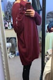 I wanted to love this so much because I love oversized sweaters. I got the size XS/Small but there should definitely be a size even smaller than that. I'm 5'1" so I always have to be careful when it comes sizing - this makes me look terrible! It almost goes down to my knees in the front and hits the back of my knees in the back. It looks like I'm wearing a bag because it's so shapeless. I tried this sweater on 3 different times just wanting to make it work but every time I do I remember how big it is on me. I will probably have to donate it now since the return window has passed. - Brenda C.
