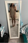 I ordered a size extra small, and the first picture shows how large it is on me. I was disappointed at how baggy it looked on me, but nothing a couple alterations couldn't fix! I had someone bring it up in the shoulders, take in a little bit of fabric on the side, and shorten it a couple inches... it fits me perfectly and proportionally now (second picture)!! Most people aren't as small as I am so they most likely will not have this problem, just order a size down! :) - Hayley V.