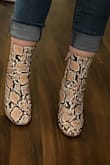 I am 5' 5," 120lbs, and my legs are very proportional to my body. My calf muscles are very average in size, so I know I am not an anomaly. The boots are adorable, and I wanted so badly to love them. When I got them out of the box I was so excited, the color, style and material look excellent. Sadly they were way, way, WAY too tight around the top. So tight I could barely get the zipper up, and I mean, look at these images- they're comical. My foot fit in the shoe without any issues and the size was true (I am an 8.5): plenty of toe space, heel height was comfortable, I have average width feet and they felt good. BUT MY GOODNESS it choked my legs so bad I knew after 20 minutes of walking I'd have open sores and no circulation. I couldn't wear a thin tall sock underneath OR tuck in my jeans. I would give 5 stars if I could wear them. I noticed in the comments and in the model images, those who liked them had slender and long legs. Probably a no go if you're average height/ weight. - Brennah K.