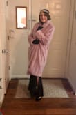 I LOVE this coat! Not only is it super warm, lined, well made, and a great color, but it makes me feel FABULOUS! I'm almost 5'8 and ordered a small. While still a little wide, it is a big luxurious coat so I don't think the XS would fit better (especially the arm length). I keep it unlatched for the most part and just wrap it closed when I need too. It truly is one of the most fun yet luxurious pieces of clothing I own (and for such a great price!), and I feel fantastic when I wear it!! I definitely recommend this buy. - Lauren L.