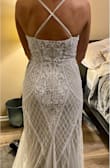Loved this dress, wish it had a lower back but that's just my preference. Would've been too expensive to alter due to the beading. Will keep looking but this is a contender for my wedding dress. Loved the beading and color and deep V. It fit surprisingly well. - Olivia H.